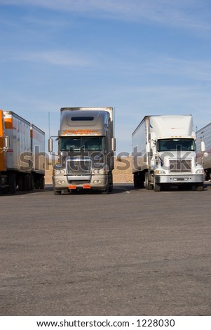 a group of large trucks in a row