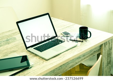 A office setup with a Laptop computer and a Tablet PC.