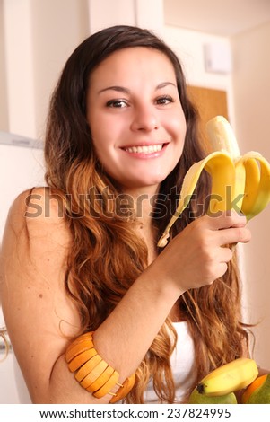 A young woman eating a Banana.