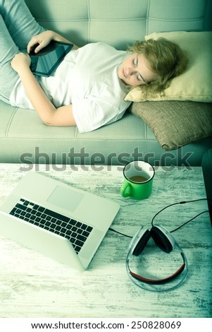 Young plus size woman listening to Audio in front of a laptop