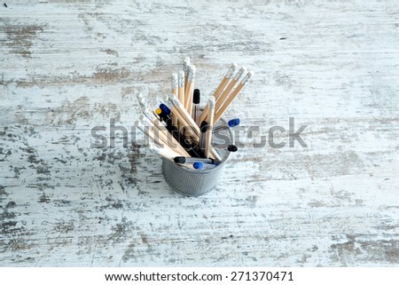 Some Pencils on a wooden Desktop.