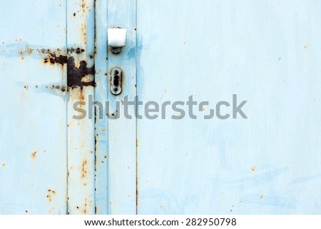 A metal door of a abandoned industrial building.