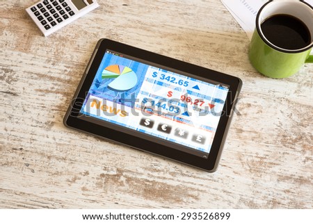 Stock market trading and research software on a Tablet PC on a office Desktop.