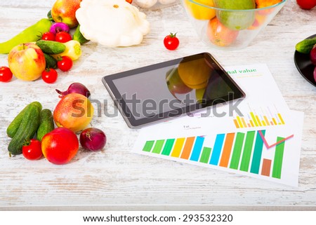 Organic fruit and vegetable on the table with a tablet PC.