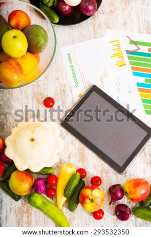 Organic fruit and vegetable on the table with a tablet PC.