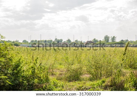 ROESZKE, HUNGARY - SEPTEMBER 15: A Refugee or Military camp related to the current Refugee crisis on the Serbian side on September 15, 2015 in Roeszke, Hungary.