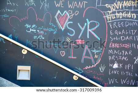 BUDAPEST, HUNGARY - SEPTEMBER 04: Messages related to the Refugee situation written on a wall at the Train Station Keleti Palyudvar on September 04, 2015 in Budapest, Hungary.