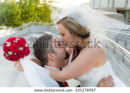 The bride kisses the groom