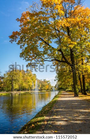 Sunny day in autumn near park and river