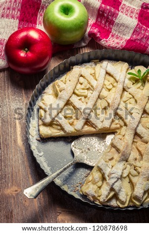 Apples and apple cake decorated with icing sugar