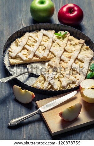 Cutting fruits and baked apple pie