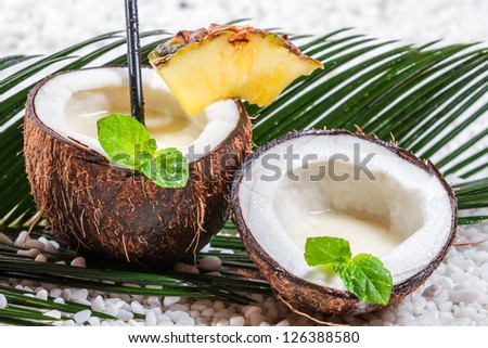 Closeup of fresh pinacolada drink served in a coconut