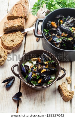 Freshly cooked mussels with garlic and parsley at home
