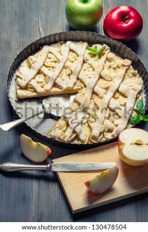 Chopping fruits and baked apple pie