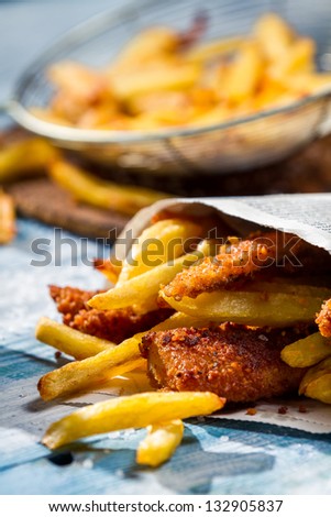 Homemade Fish & Chips served in the newspaper