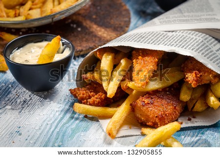 Closeup of Fish & Chips served in the newspaper