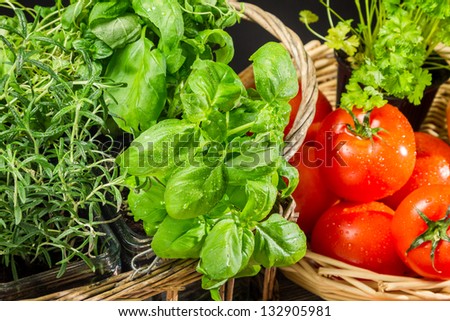 Fresh vegetables and herbs in a basket