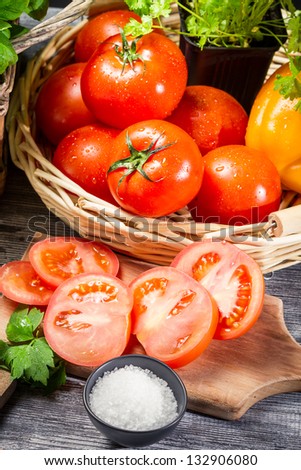 Fresh tomato and herbs in a basket