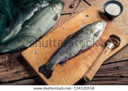 Preparing trout for dinner in the countryside