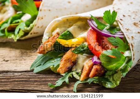 Closeup Of Kebab In A Pancake With Vegetables