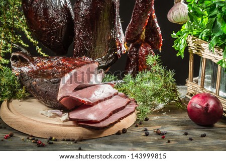 Closeup of freshly smoked ham in a rural smokehouse