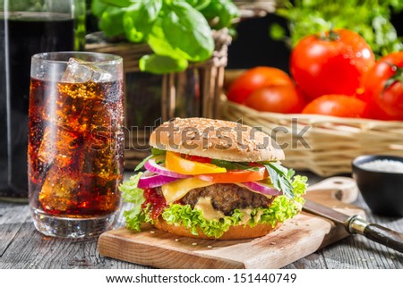 Homemade hamburger and a Coke with ice
