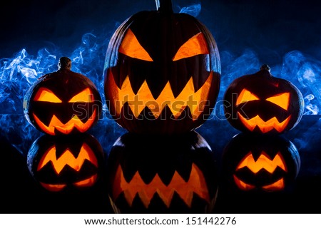 Group pumpkins for Halloween on a blue background