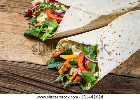 Kebab in a pancake with vegetables and chicken