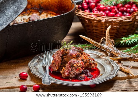 Venison with cranberry sauce and rosemary straight from the forest