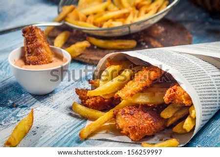 Closeup of Fish & Chips served in paper
