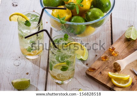Cold drink with fresh citrus fruit