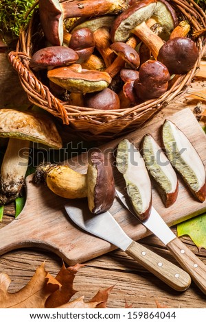 Cutting forest mushrooms in a pan