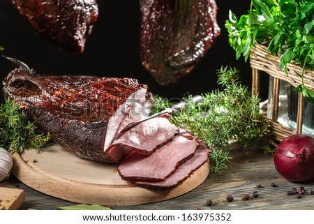 Freshly smoked ham in a rural pantry
