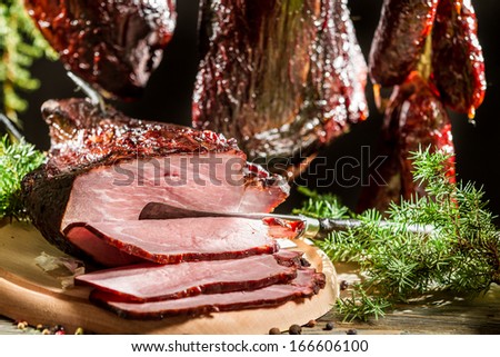 Closeup of freshly smoked ham in a rural smokehouse