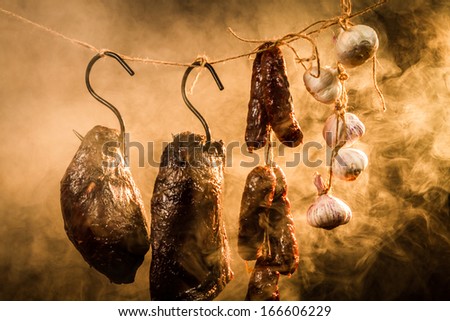 Ham, sausage and garlic in a smokehouse