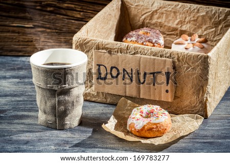 Hot coffee and box full of donuts
