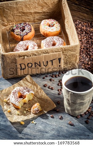 Box full of donuts with coffee