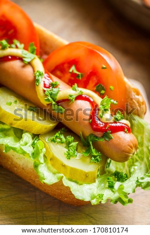Fresh hot dog with sausage and vegetables
