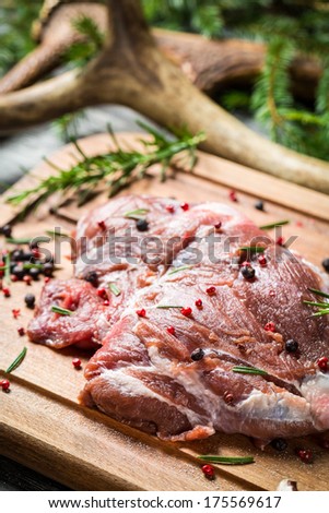 Marinating fresh meat with the rosemary