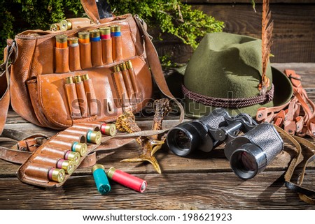 Bag, bullets and hat in a hunting lodge