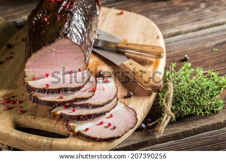 Freshly smoked ham in a rural pantry