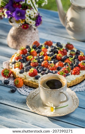 Coffee and fruit tarts served in the garden
