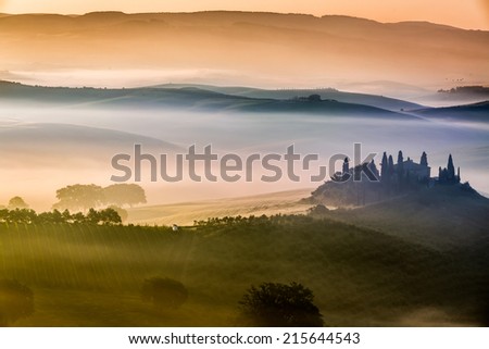 Beautiful sunrise over the valley of olive groves and vines