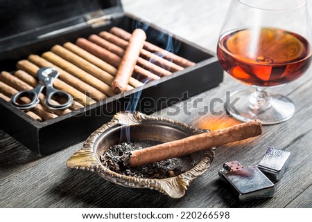 Aroma of cognac and cigar fuming