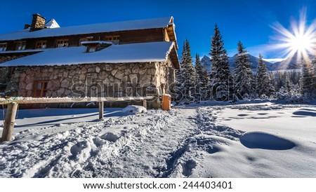 Mountain huts and sunrise in winter