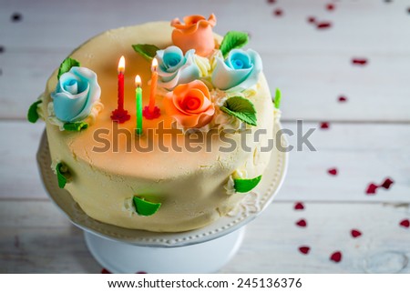 Birthday cake with candles and roses