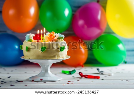 Party with balloons and a birthday cake