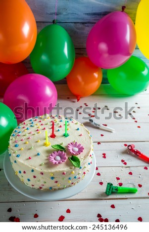 Birthday cake with candles at a party