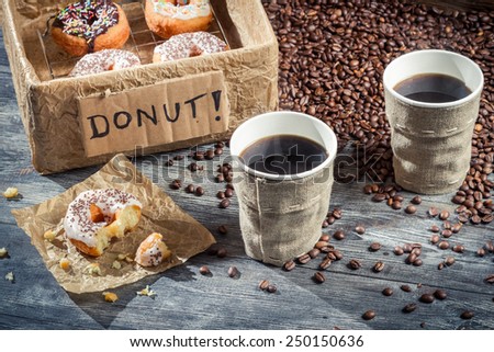 Box full of donuts with coffee for two