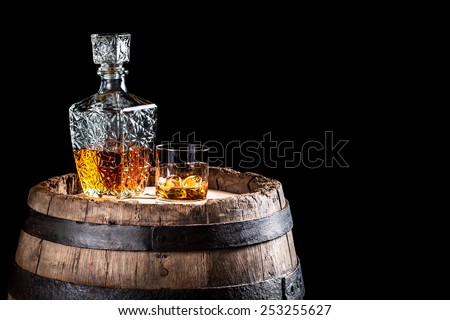 Old oak barrel and a glass of Scotch